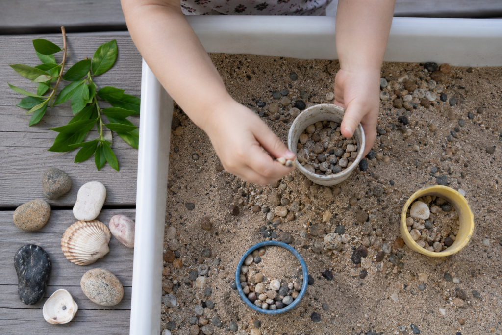 outdoor sensory activities for toddlers
toddler playing with sand outside